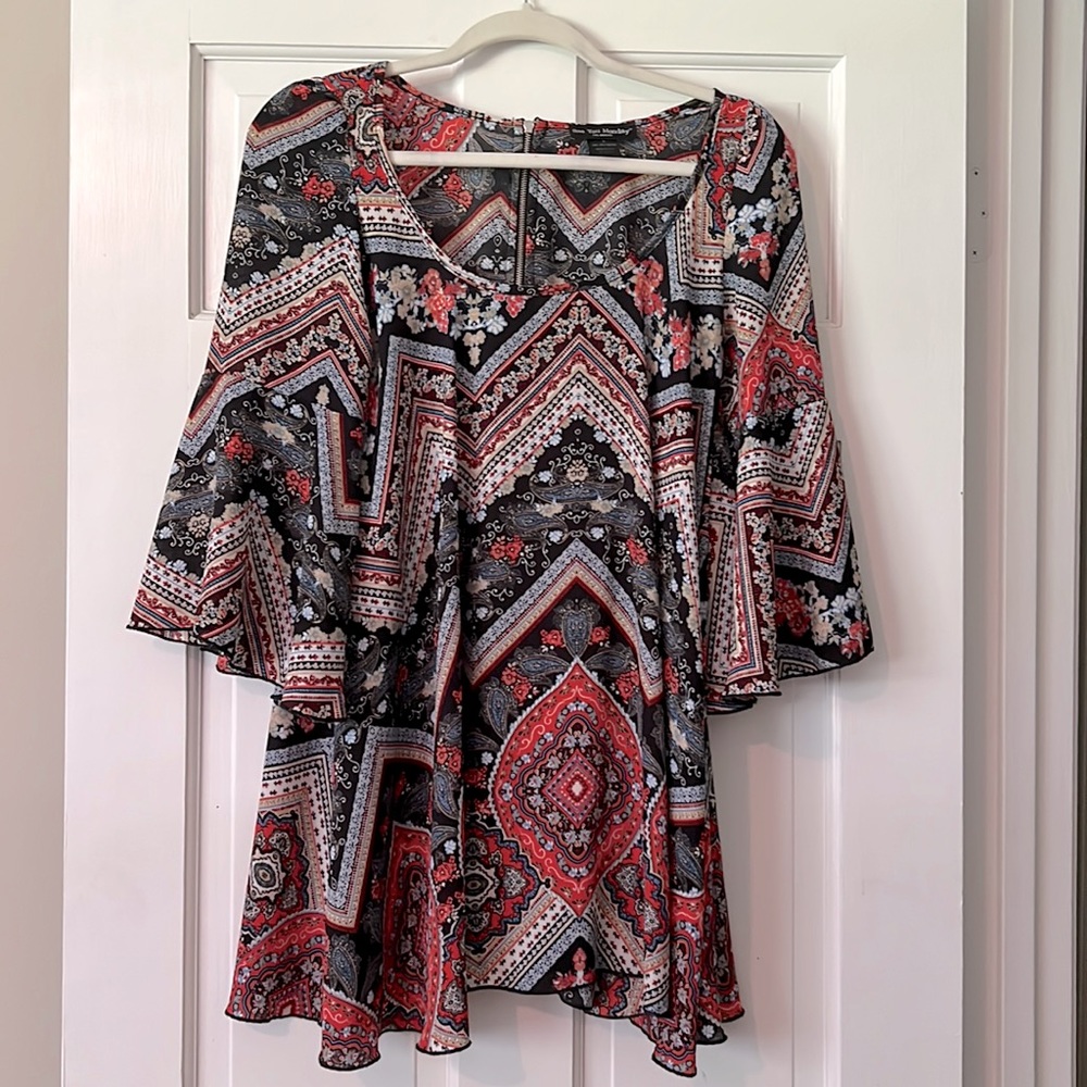 orange, black, & blue See You Monday, small mini dress with flared sleeves.